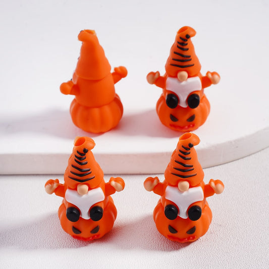 Four small orange gnomes with pumpkin hats on a white background

