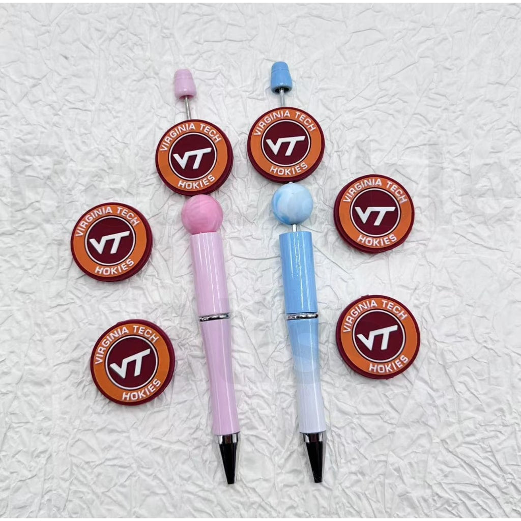 Two pens with Virginia Tech Hokies logo on a textured white background