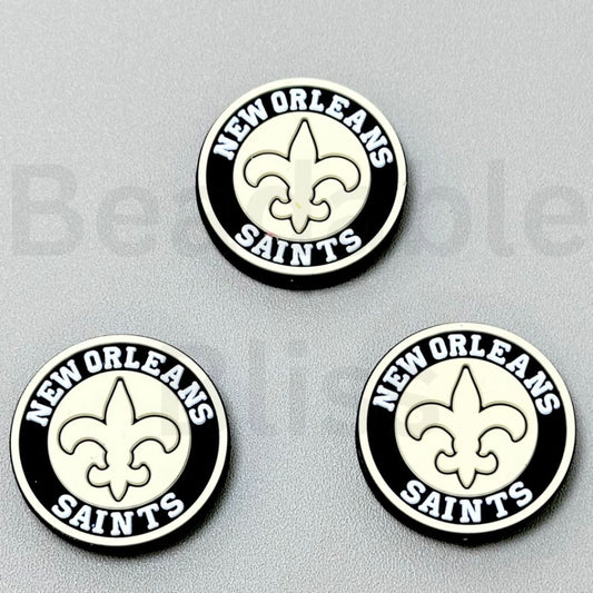 Three New Orleans Saints logos on a gray background

