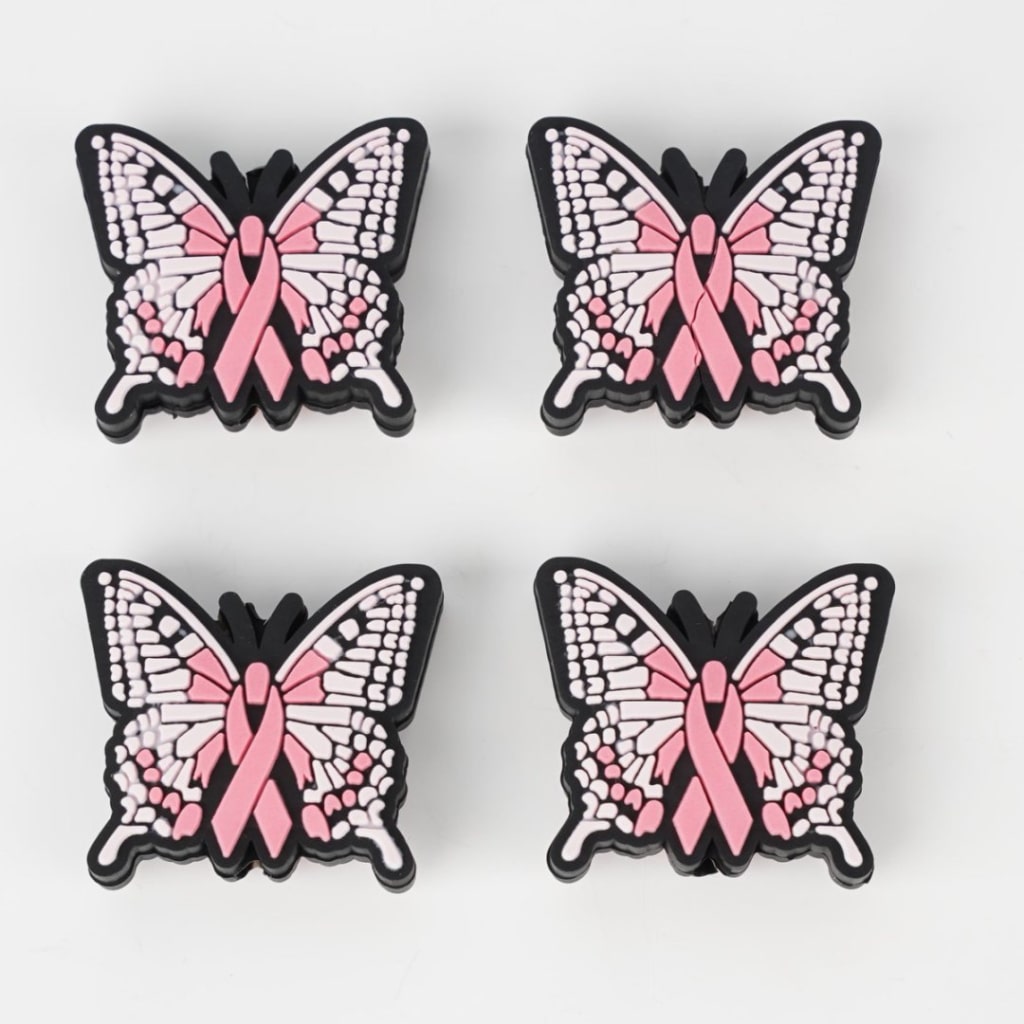 A set of silicone beads shaped like butterflies with a pink ribbon design on them.

