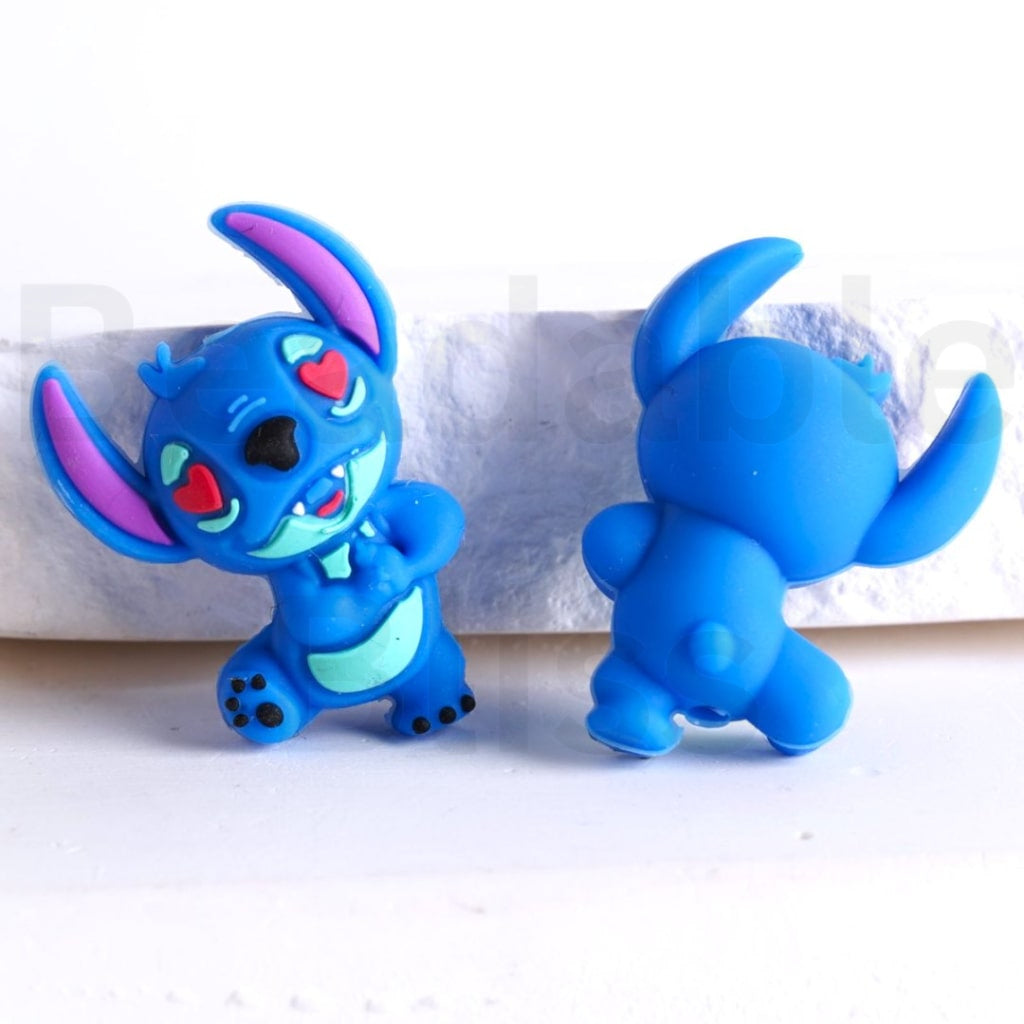 Two blue cartoon character figurines on a white background

