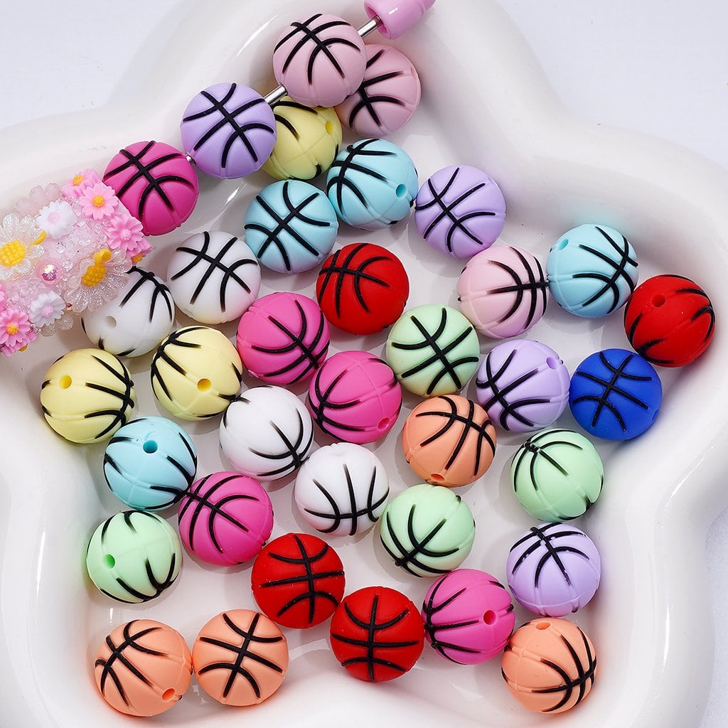 Colorful basketball-shaped beads on a white background

