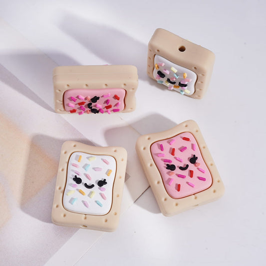 Four cute, cartoon-style cookie-shaped phone cases with colorful designs on a white background.