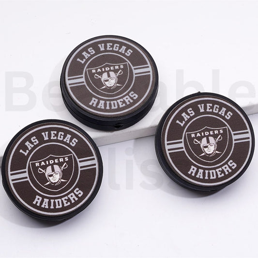 Three Las Vegas Raiders logo coasters on a white background

