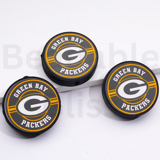 Three Green Bay Packers bottle caps on a white background

