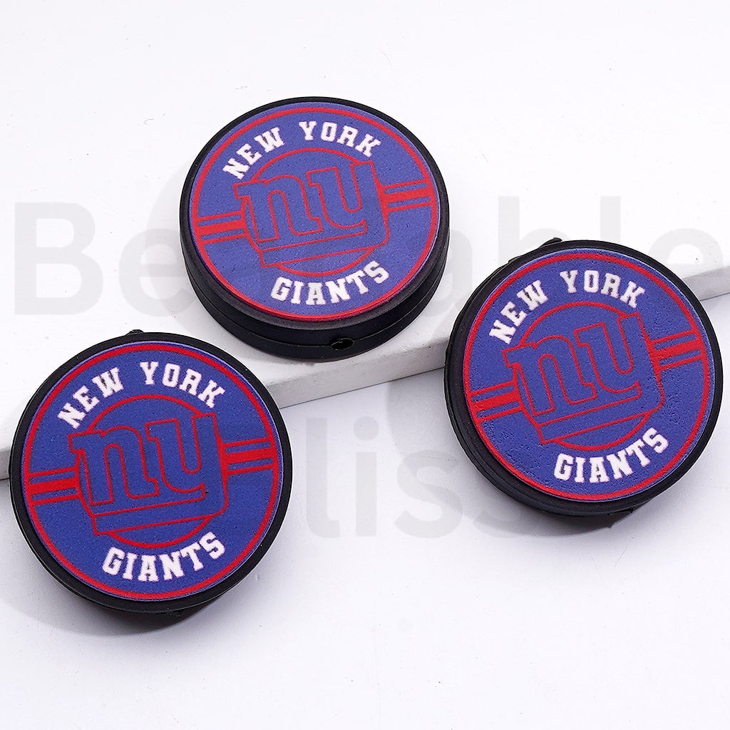 Three New York Giants logo coasters on a white surface

