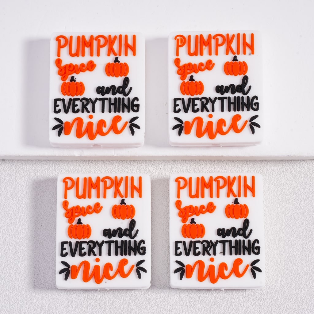 Four identical decorative signs with 'Pumpkin spice and everything nice' text on a white background.

