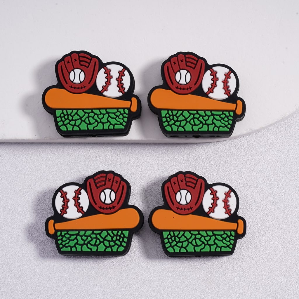 Four baseball-themed earrings on a white background

