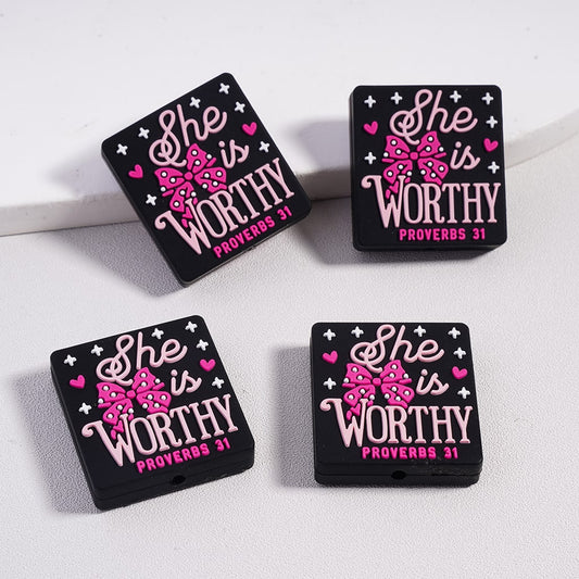 Four black and pink 'She is Worthy Proverbs 31' coasters on a white surface.

