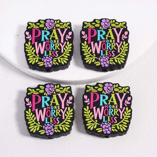 Four colorful decorative magnets with 'Pray More Worry Less' text on a white background.

