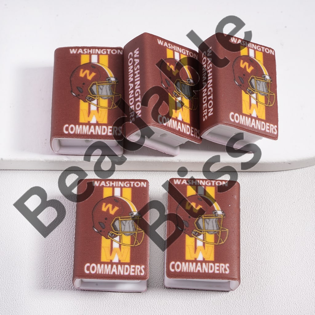 Washington Commanders-themed can coolers on a white surface

