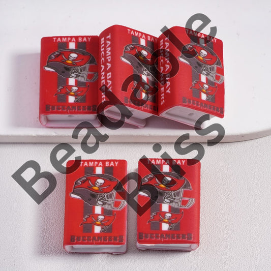 Tampa Bay Buccaneers-themed playing cards on a white surface

