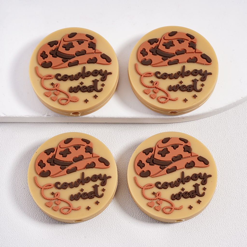 Four round cookies with cowboy hats and 'cowboy west' text on a white background

