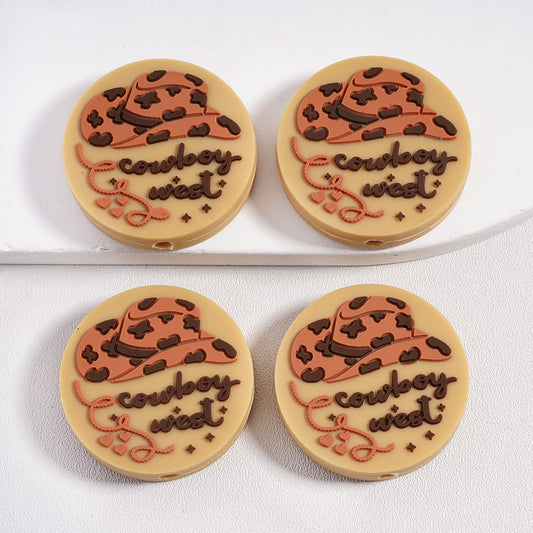Four round cookies with cowboy hats and 'cowboy west' text on a white background

