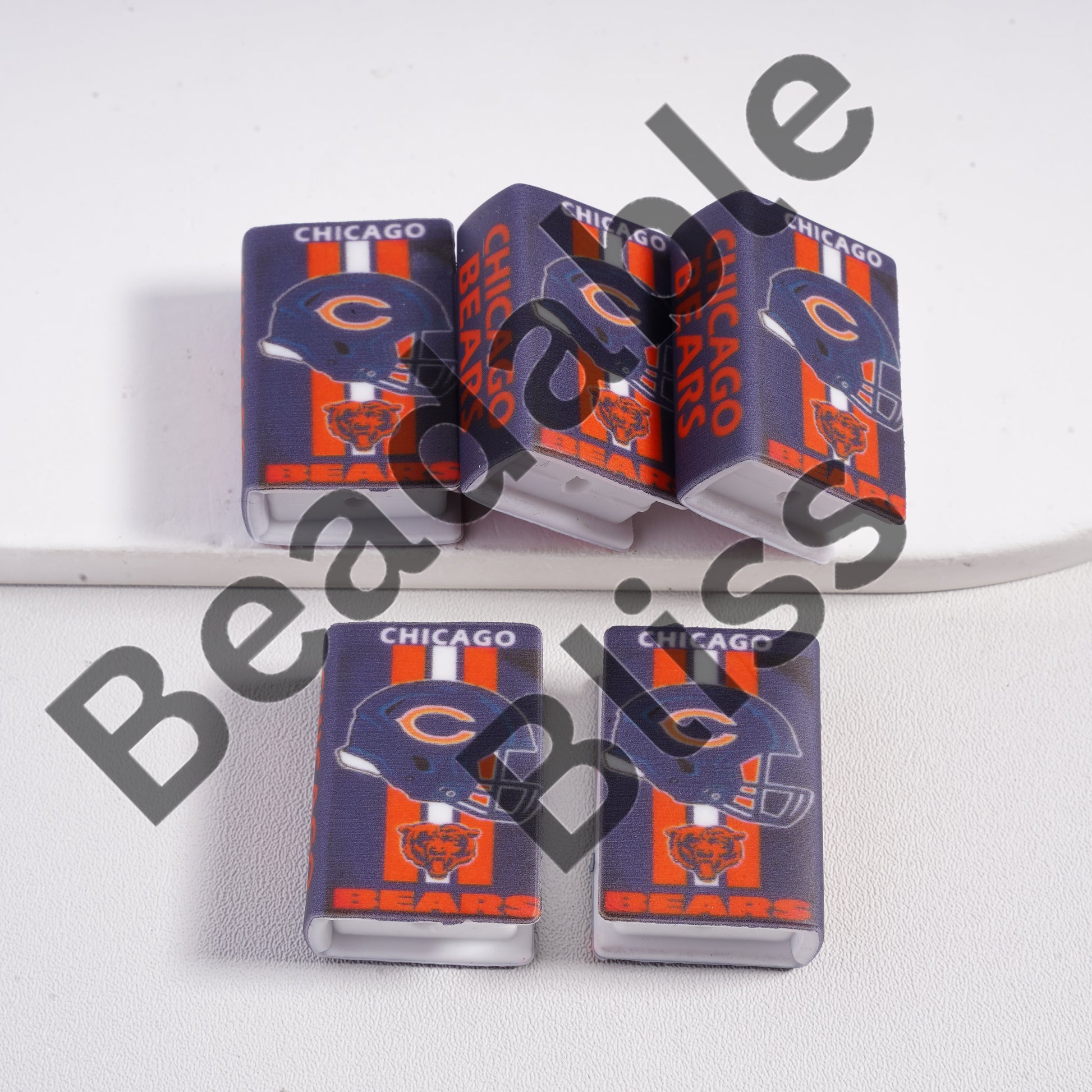 Chicago Bears-themed nail polish bottles on a white background

