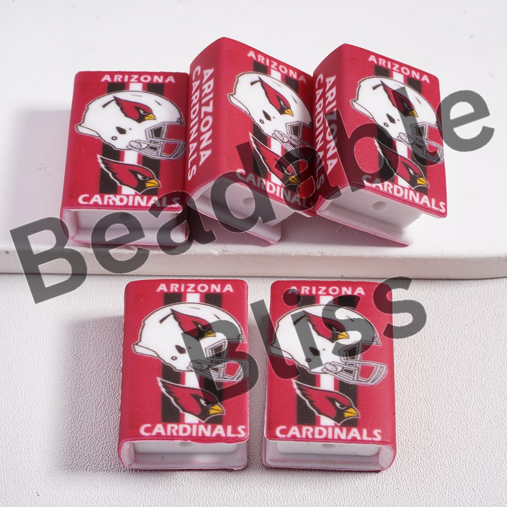 Four Arizona Cardinals-themed phone cases on a white surface with 'beadablebliss' branding.

