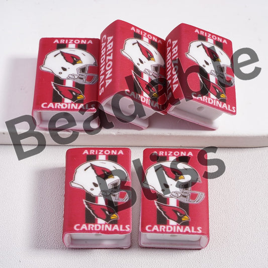 Four Arizona Cardinals-themed phone cases on a white surface with 'beadablebliss' branding.

