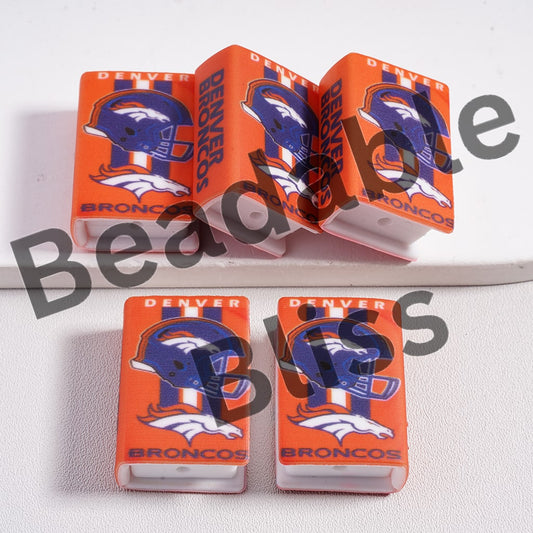 Denver Broncos-themed dice set on a white background with beadablebliss branding.

