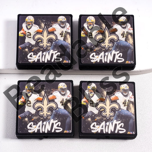 Four coasters with New Orleans Saints logo and players on a white background

