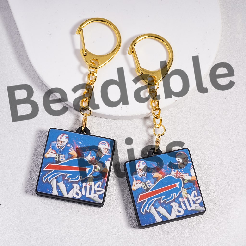 Pair of earrings with Buffalo Bills logo and player images on a white background