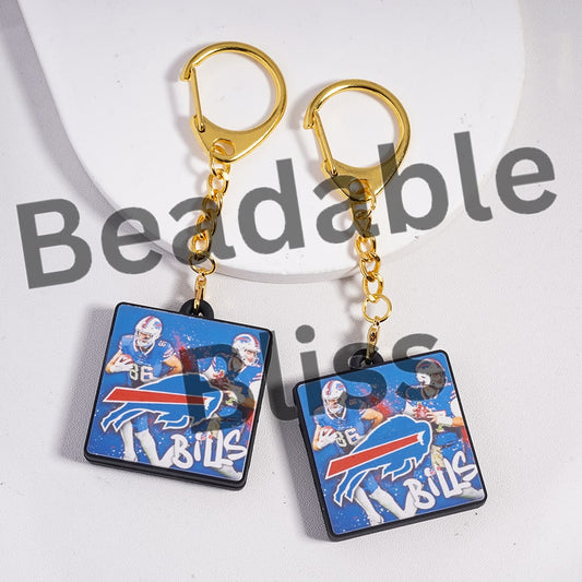 Pair of earrings with Buffalo Bills logo and player images on a white background