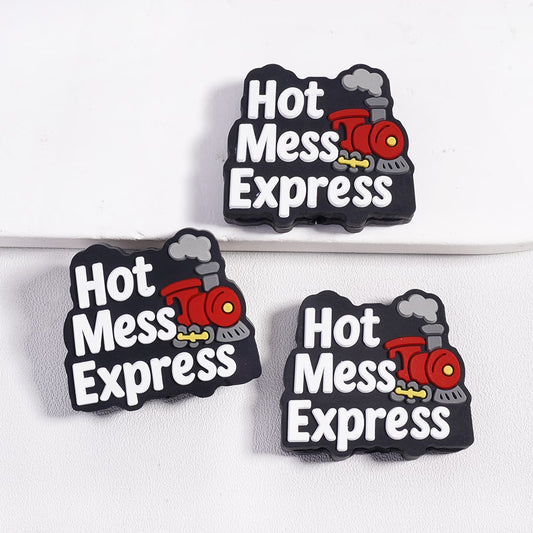 Three 'Hot Mess Express' train-shaped magnets on a white background

