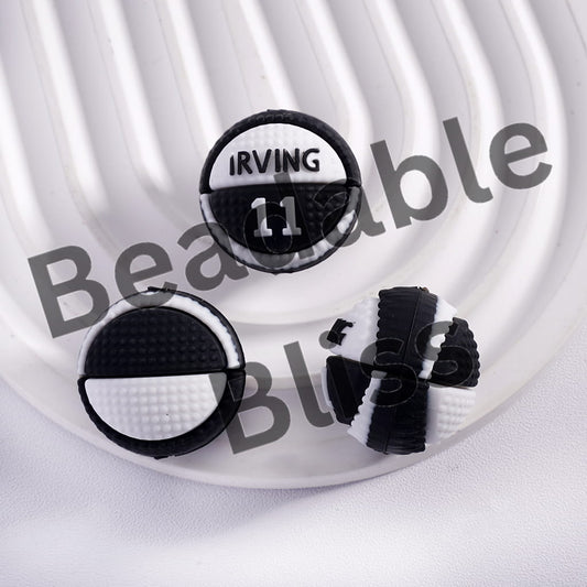 Black and white earrings with 'Irving 11' design on a white background