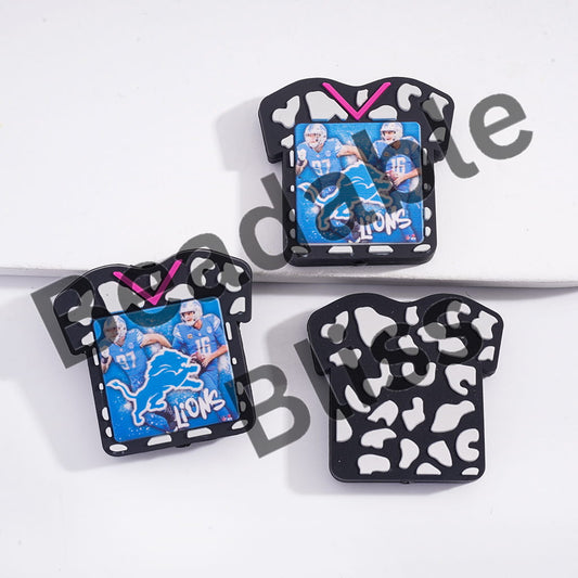 Three decorative magnets shaped like sports jerseys with team logos on a white background.