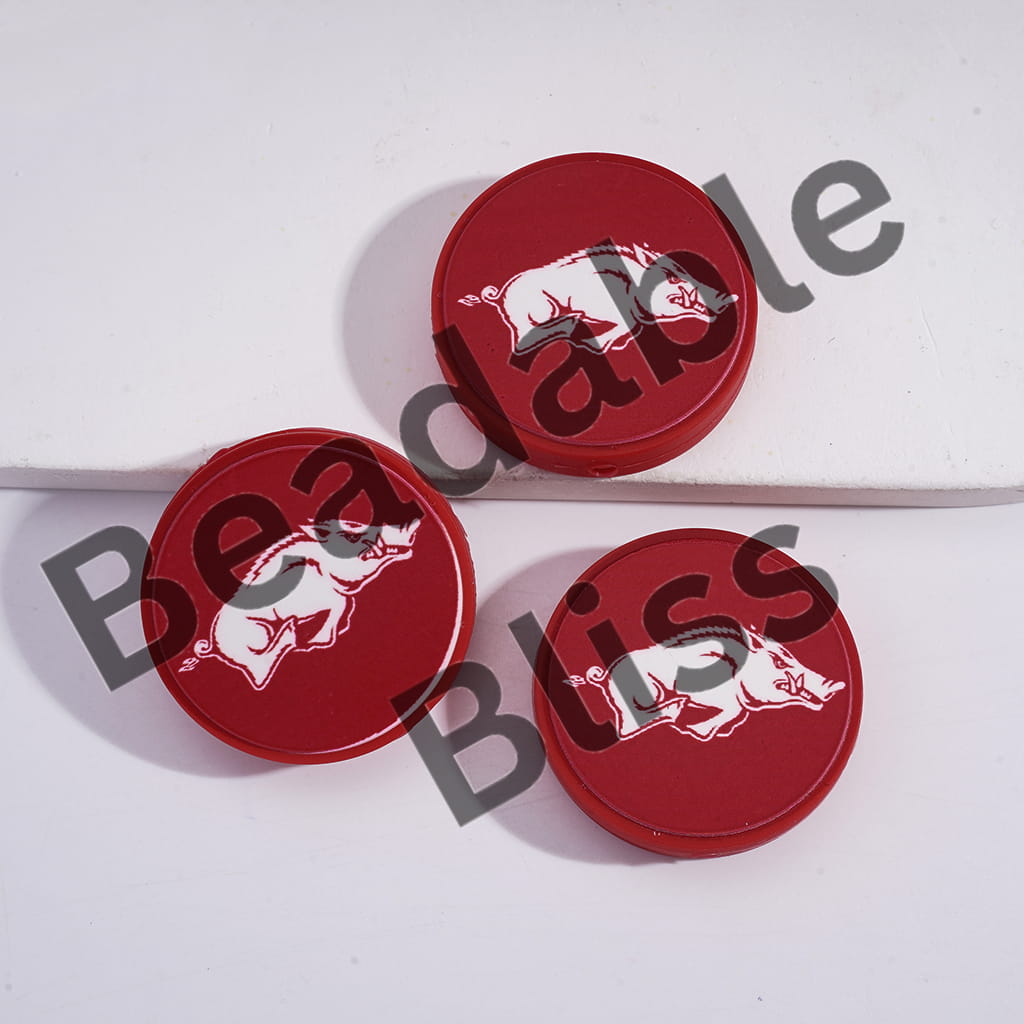 Three red circular objects with a white pig logo on a white background, featuring 'handsontable.com' text.