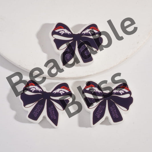 Bow-shaped items with a logo on a white background, branded 'handsontable'.