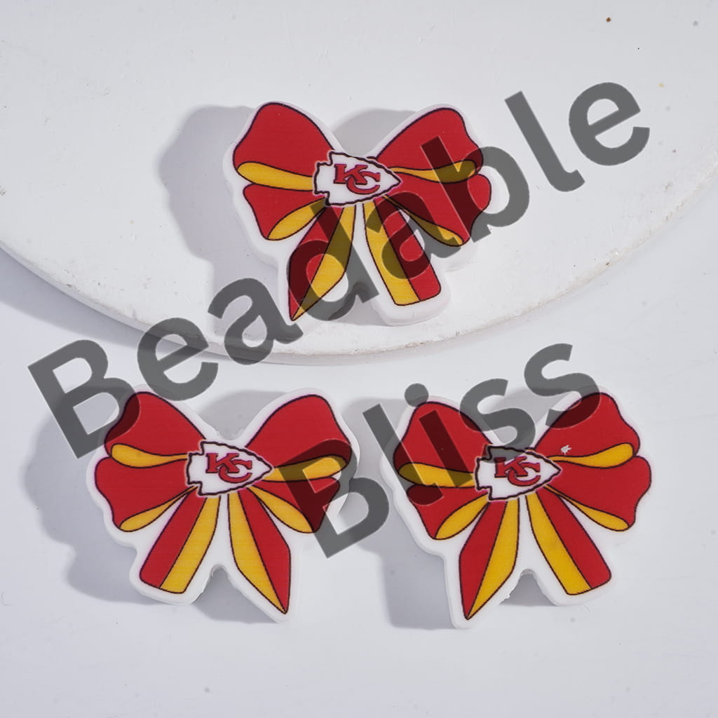 Red and yellow bows with a logo on a white background, branded 'handsontosupply.com'.