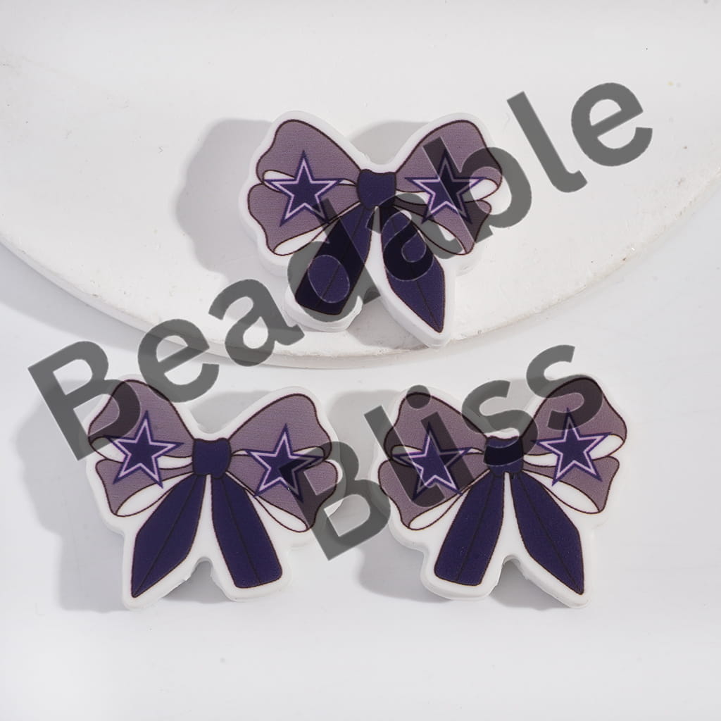 Bow-shaped earrings with star design on a white background, branded 'handsontosupply'.com'.