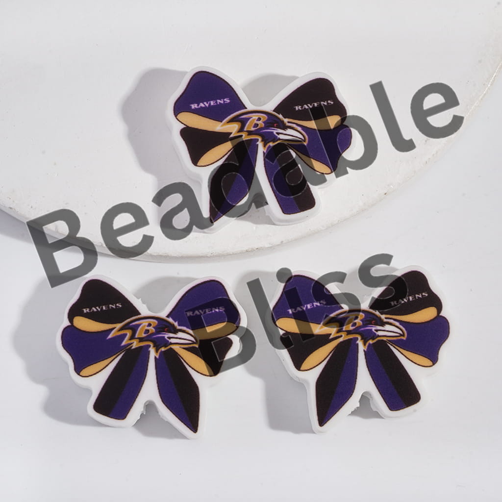 Baltimore Ravens-themed hair bows on a white background with 'handsontosupply.' branding.