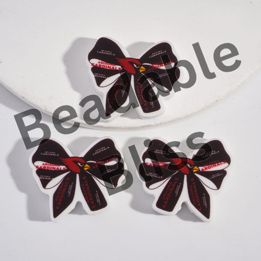 Three Arizona Cardinals-themed hair bows on a white background with 'hands on supply' branding.
