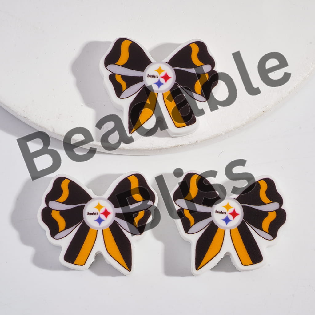 Bow-shaped earrings with a logo on a white background

