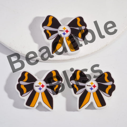 Bow-shaped earrings with a logo on a white background

