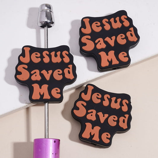 Silicone Focal Beads with Brown-Orange Text "Jesus Saved Me" on Black Background