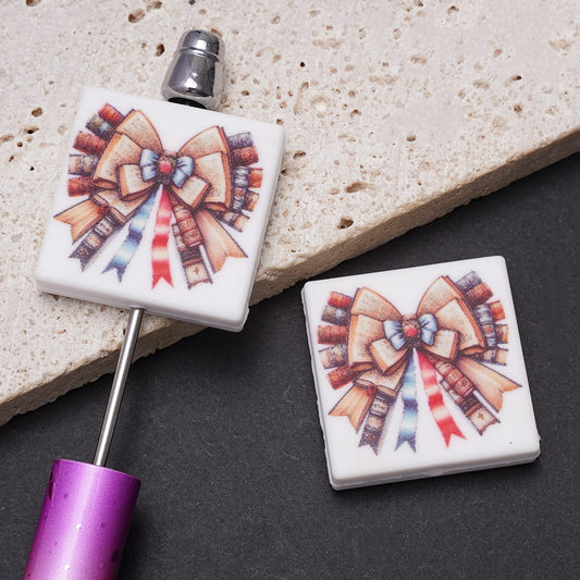 Silicone Focal Beads with Bowtie Made Up of Opened Books Prints, Flat Square Shape