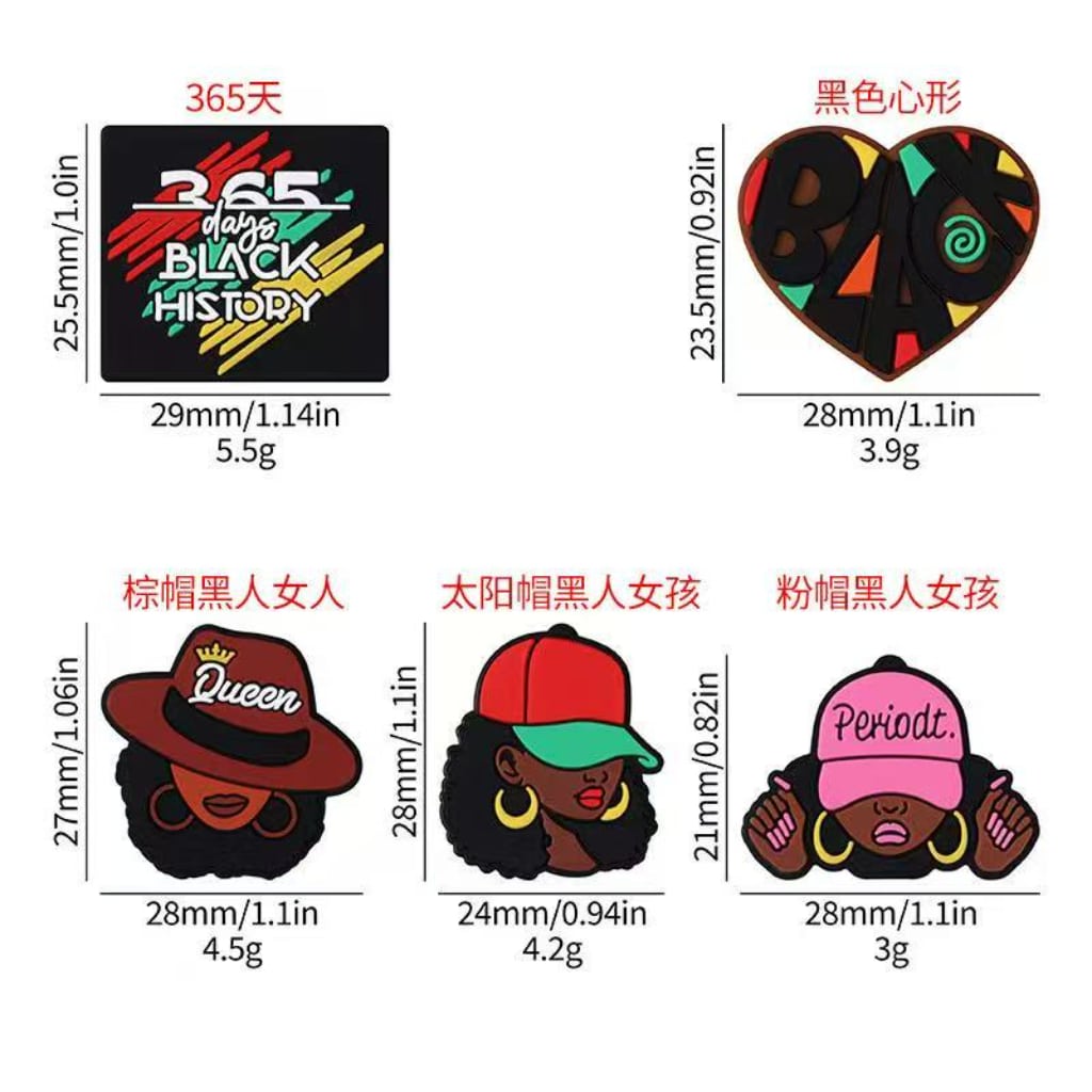 A selection of silicone beads with various designs including representations of Black History Month and Juneteenth themes. Each bead is colorful and has a unique design.

