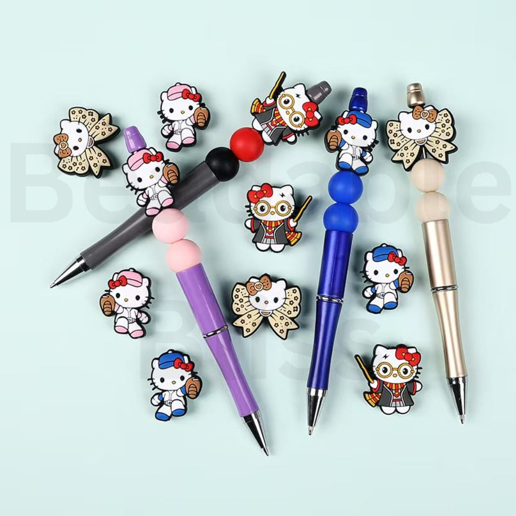 Set of pens with Hello Kitty character charms on a light blue background, branded 'beadbalebliss'.

