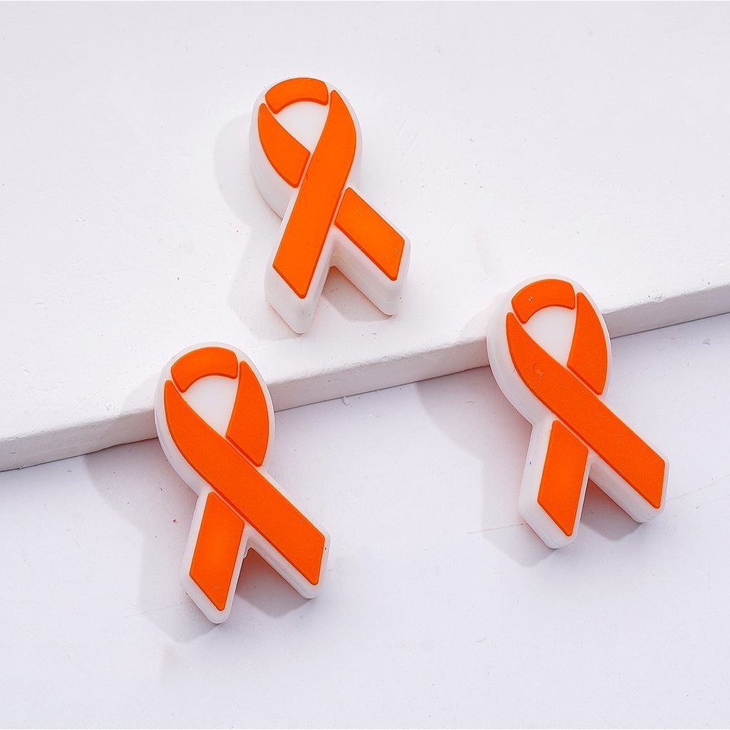 Orange ribbon earrings on a white background

