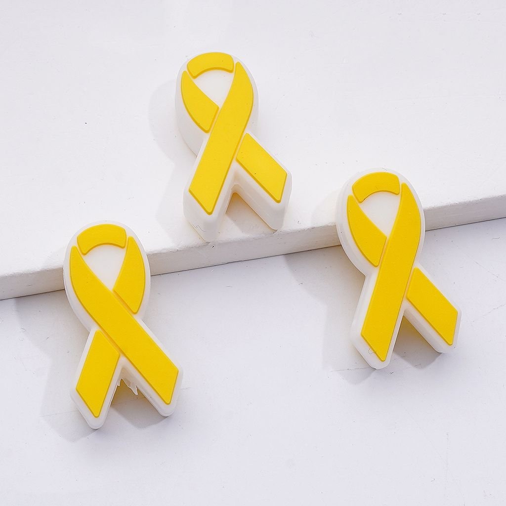 Yellow ribbon earrings on a white background

