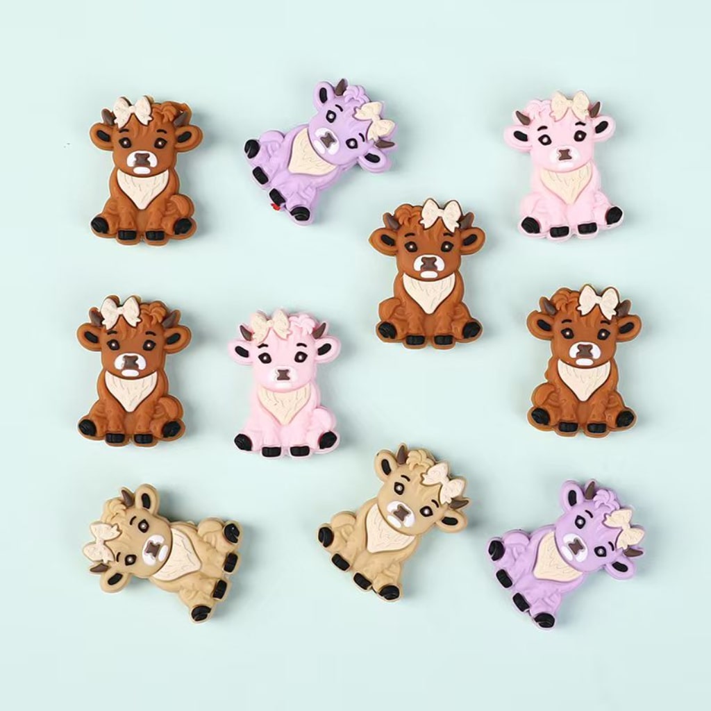 Set of cartoon animal figurines on a light blue background

