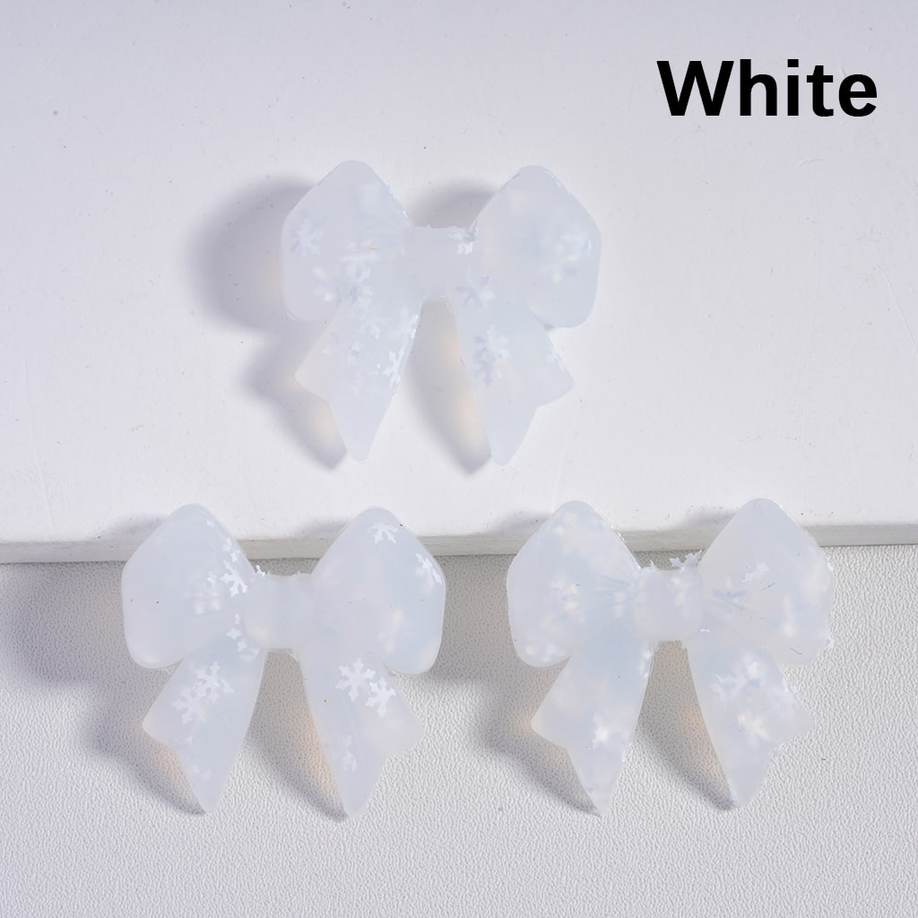 White bow-shaped hair accessories on a white background with 'White' text above.

