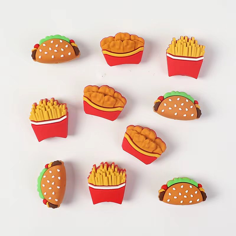 Set of colorful fast food-themed erasers on a white background

