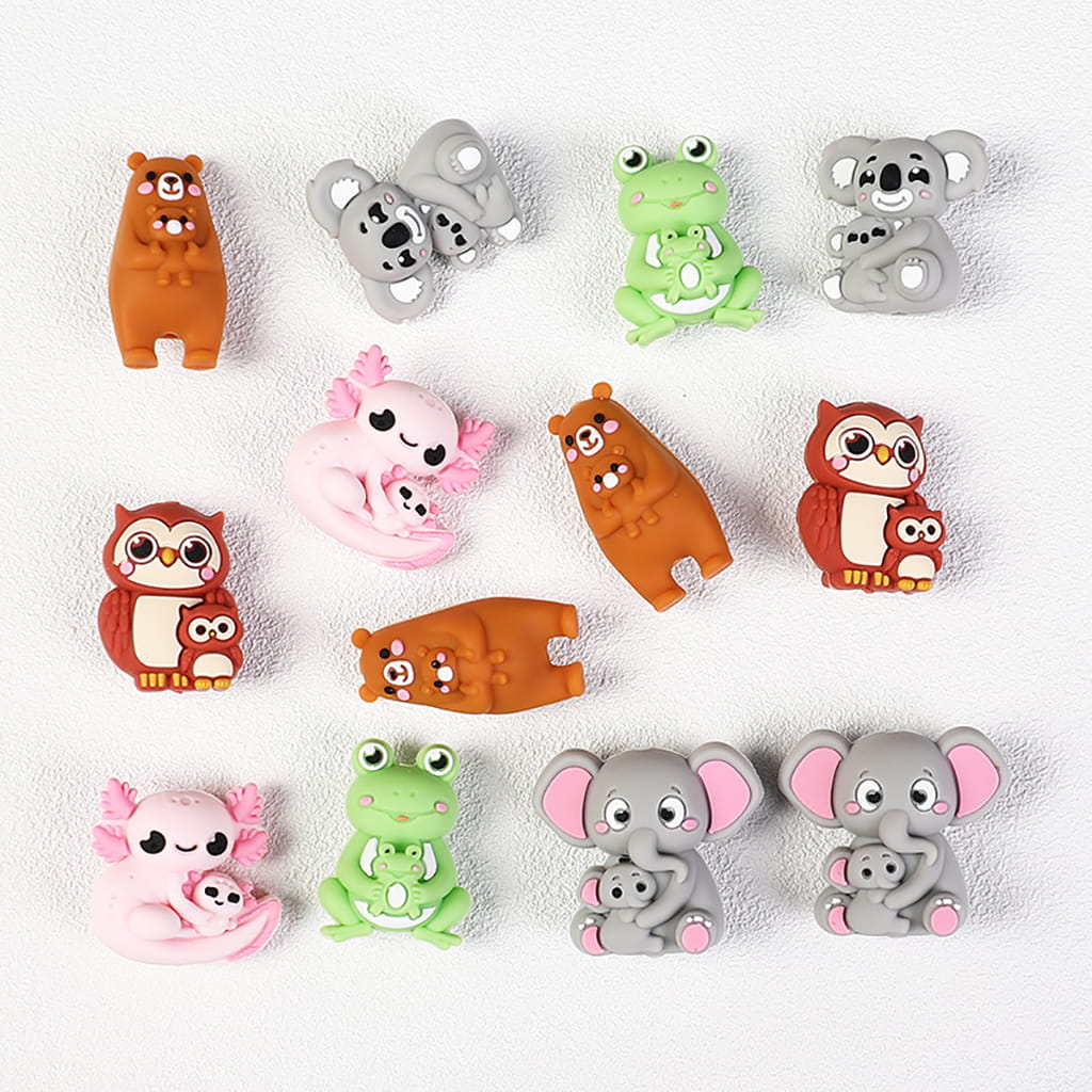Set of colorful animal figurines on a white background