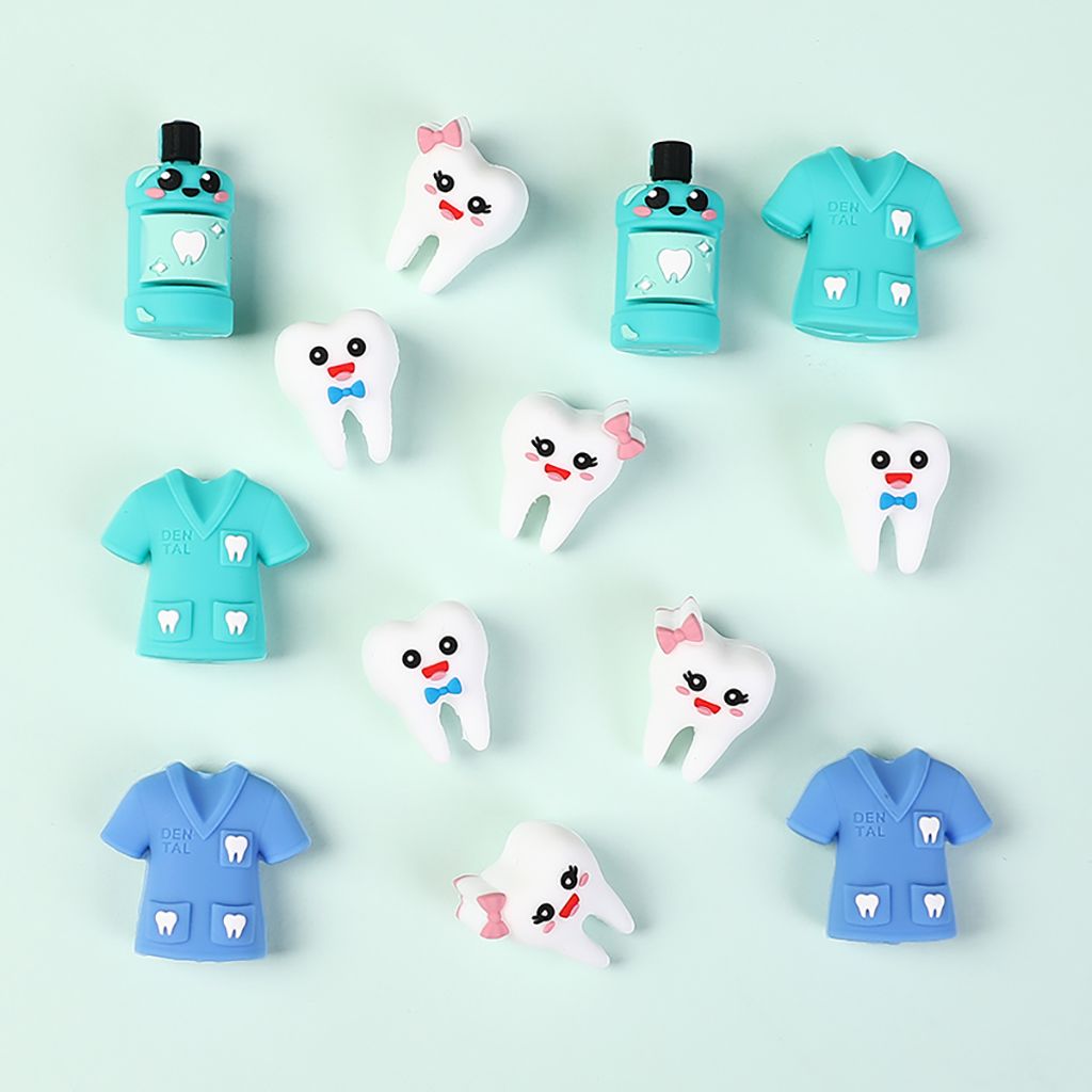 Set of dental-themed erasers including tooth shapes and dental office outfits on a light blue background.