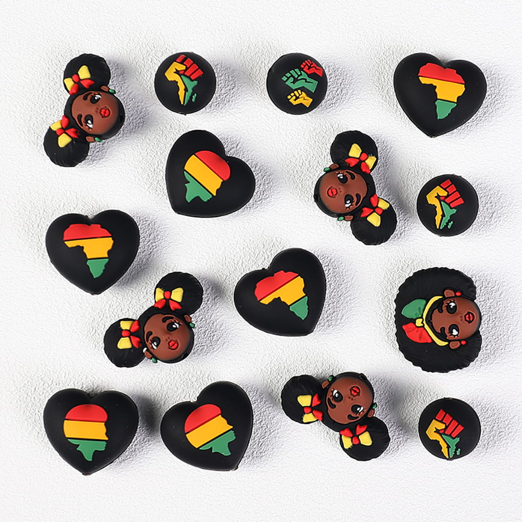 Collection of decorative items with African American figures and heart designs on a white background