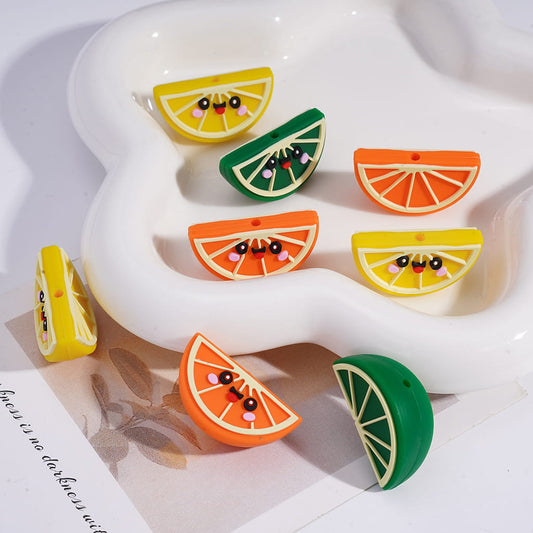 Colorful fruit slice erasers on a white surface
