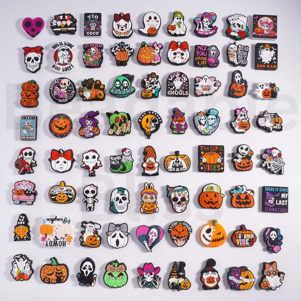 Collection of Halloween-themed pins on a white background

